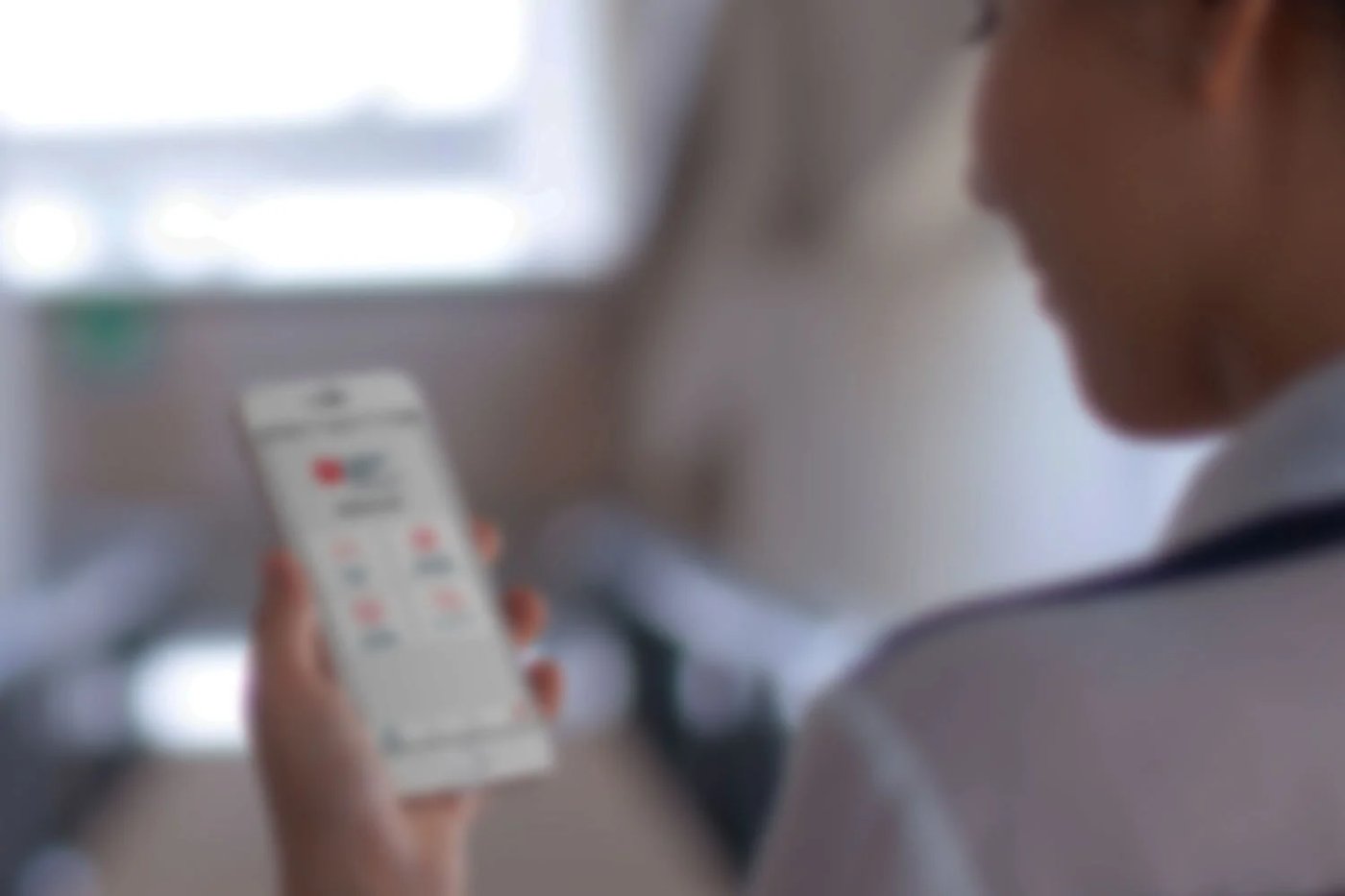 Close-up of a hand using the belairdirect app on a phone