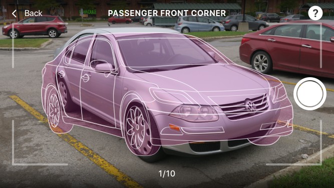 Live camera view with an augmented-reality car outline guiding the driver to align the passenger front corner shot