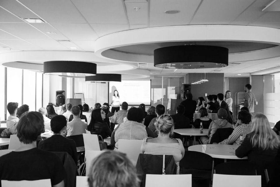 A full room listening to a themed talk at an InformalLab event