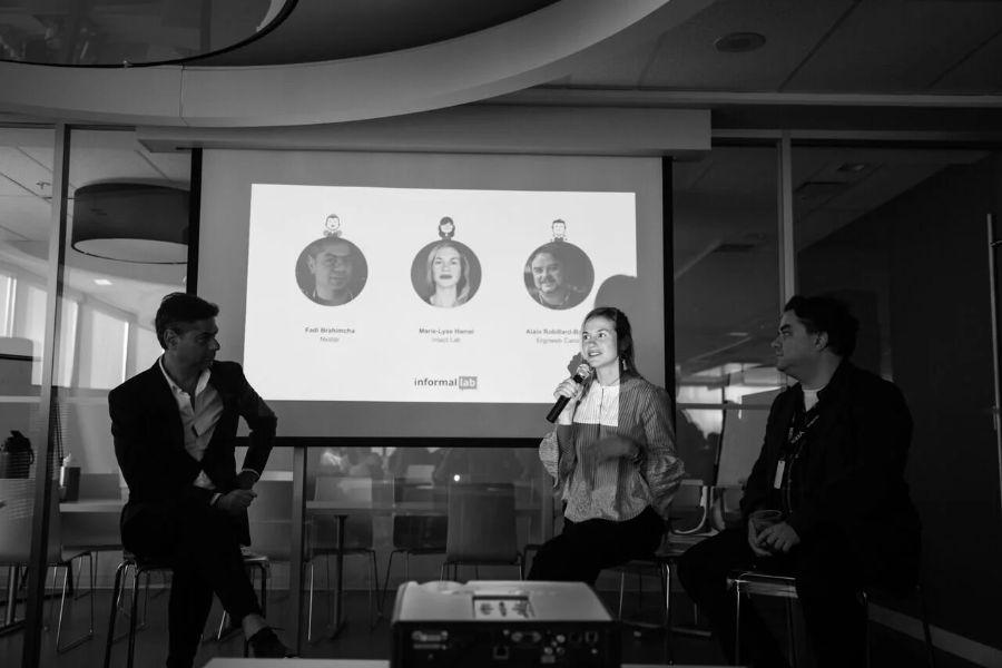 A three-person panel discussing user testing at an InformalLab event